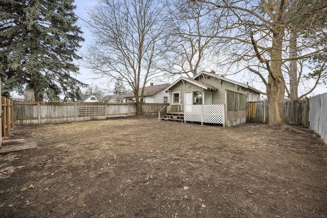 view of yard featuring a fenced backyard and a wooden deck