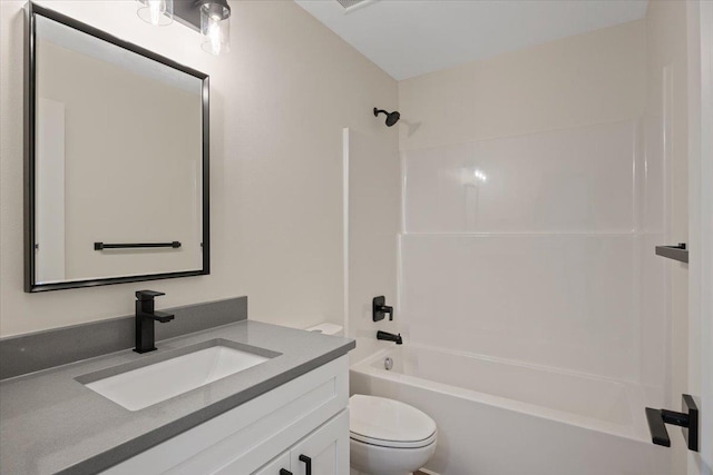 full bath with bathtub / shower combination, vanity, and toilet