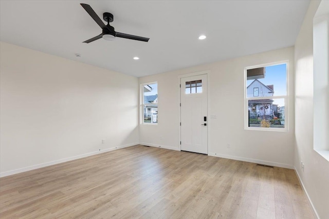 entryway featuring visible vents, baseboards, a ceiling fan, light wood-style flooring, and recessed lighting