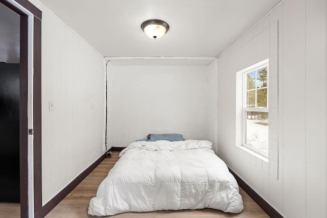 bedroom featuring wood finished floors