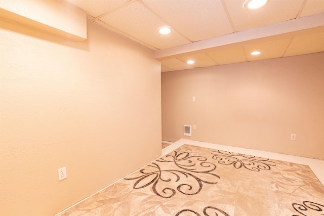 finished basement with a drop ceiling, visible vents, and recessed lighting