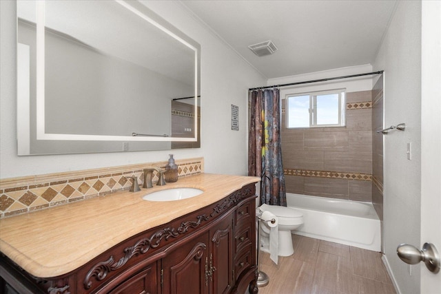 full bath with visible vents, decorative backsplash, toilet, shower / bath combination with curtain, and vanity