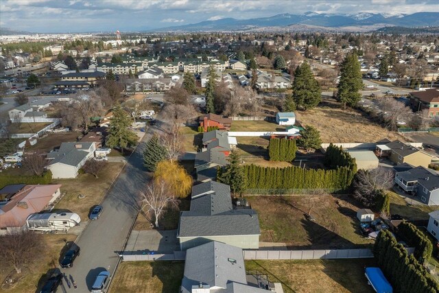 drone / aerial view with a residential view and a mountain view