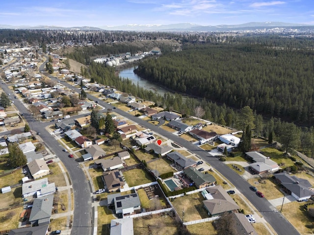 bird's eye view featuring a water view and a view of trees