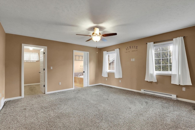 spare room featuring carpet, a baseboard radiator, ceiling fan, a textured ceiling, and baseboards