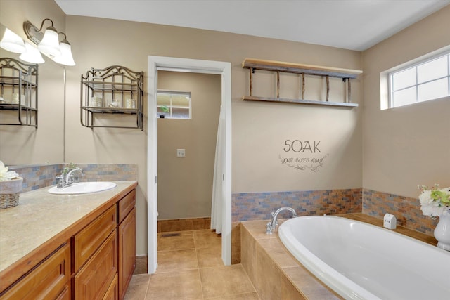 full bath with tile patterned flooring, vanity, and a bath