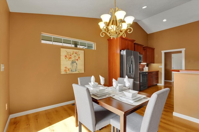 dining room featuring recessed lighting, light wood-style floors, vaulted ceiling, a chandelier, and baseboards