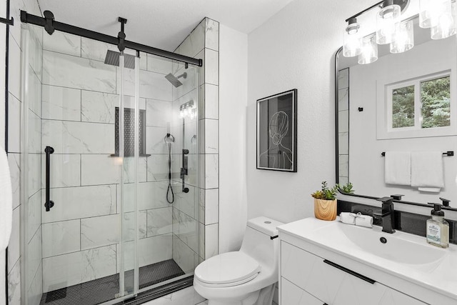 full bathroom with toilet, a shower stall, and vanity