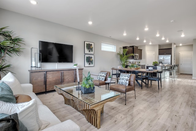 living room featuring recessed lighting and light wood finished floors