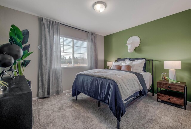 carpeted bedroom with baseboards