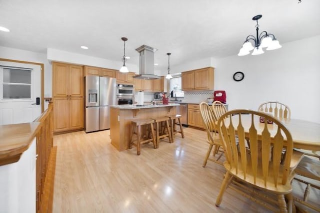 dining room with recessed lighting, a notable chandelier, and light wood-style flooring