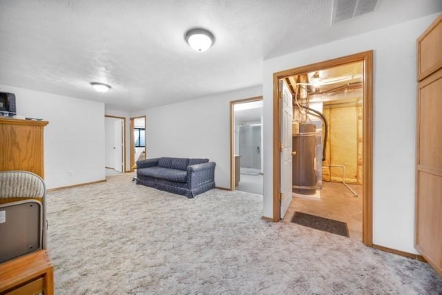 living area featuring carpet floors, baseboards, and visible vents