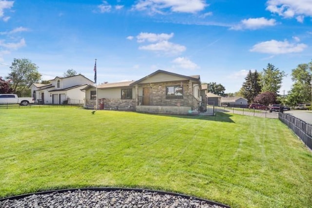 view of front of property featuring fence private yard and a front lawn