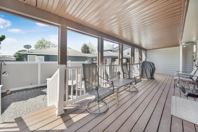 deck with grilling area and fence