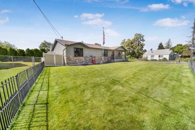 view of yard with a fenced backyard