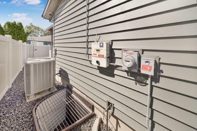 view of home's exterior featuring fence and central air condition unit