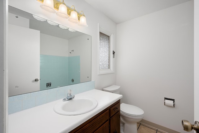 bathroom with toilet, tile patterned flooring, a shower, and vanity