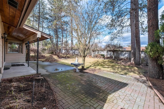 view of yard with a patio area and a fenced backyard