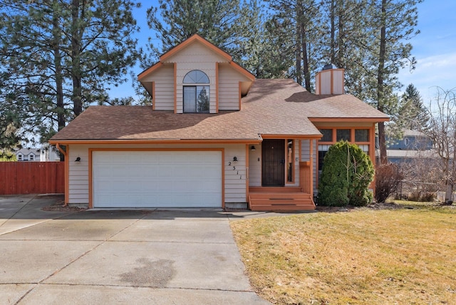 view of front of house featuring driveway, a garage, fence, and a front lawn