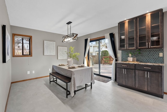 dining area featuring baseboards