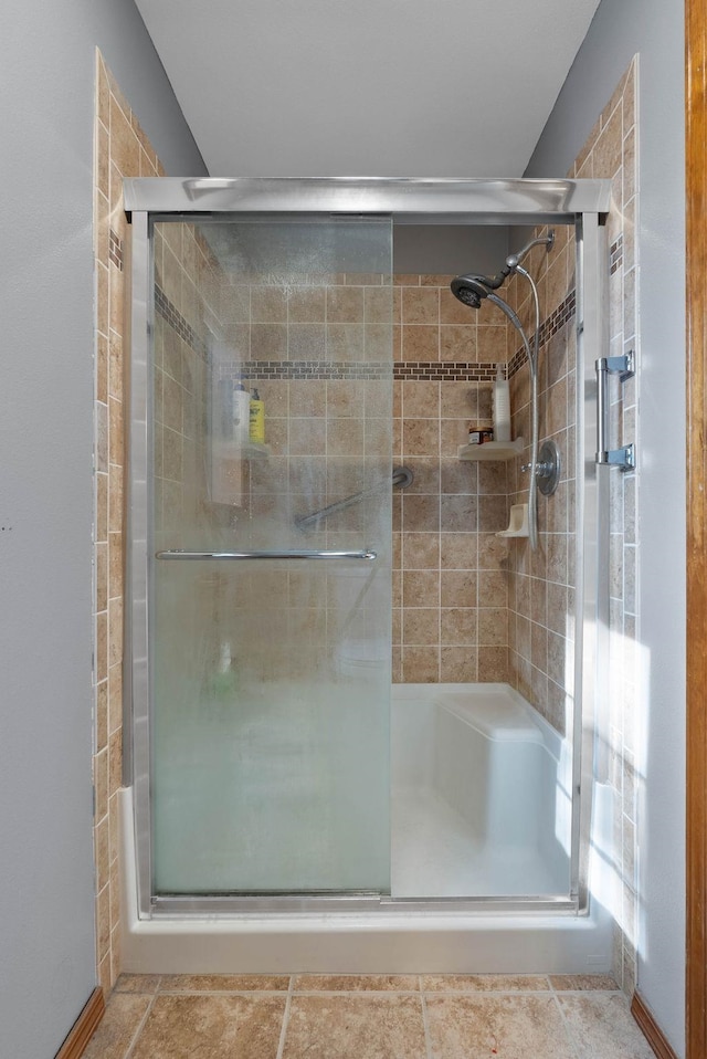 bathroom with a shower stall