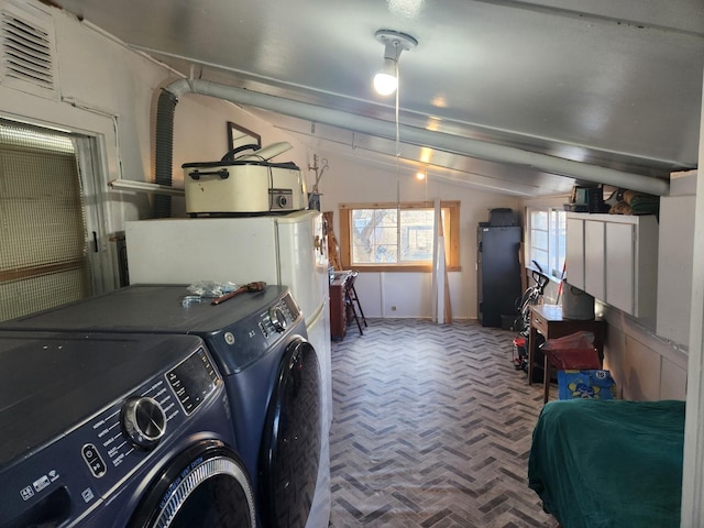 laundry area featuring laundry area and washer and clothes dryer