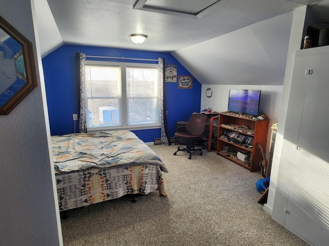 carpeted bedroom with vaulted ceiling