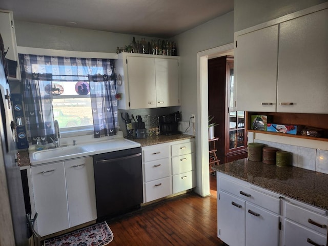 kitchen featuring dishwashing machine, dark wood-type flooring, a sink, white cabinetry, and decorative backsplash