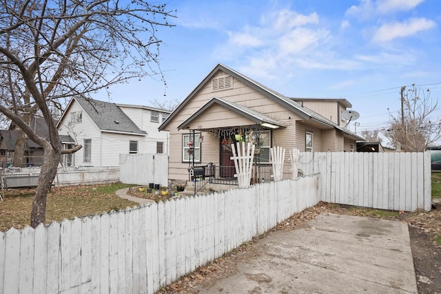 bungalow with a fenced front yard