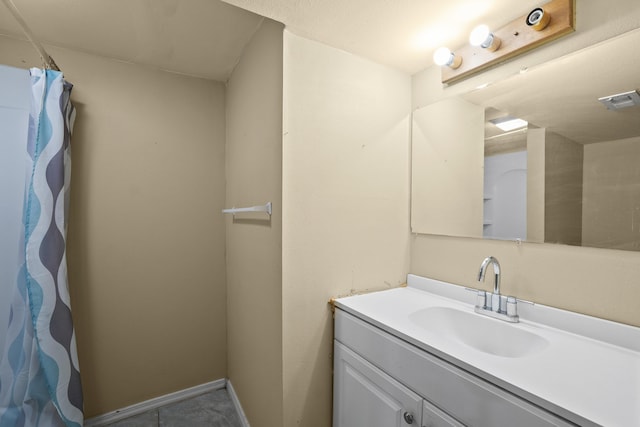 bathroom featuring visible vents, vanity, and baseboards