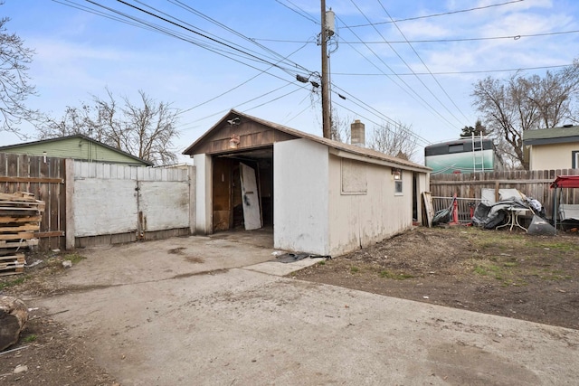 view of outbuilding with an outdoor structure and fence private yard