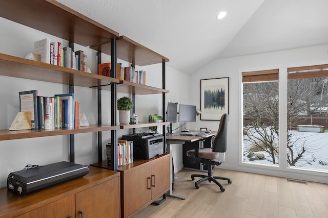 office area with lofted ceiling, light wood finished floors, visible vents, and recessed lighting