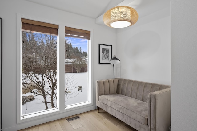 doorway to outside featuring wood finished floors and visible vents