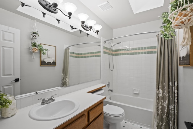 full bathroom with a skylight, shower / tub combo with curtain, visible vents, toilet, and vanity