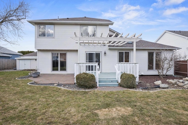 back of house with a lawn, a patio area, fence, a pergola, and a wooden deck