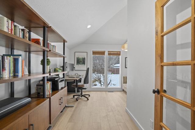 office space with light wood-type flooring, lofted ceiling, baseboards, and recessed lighting