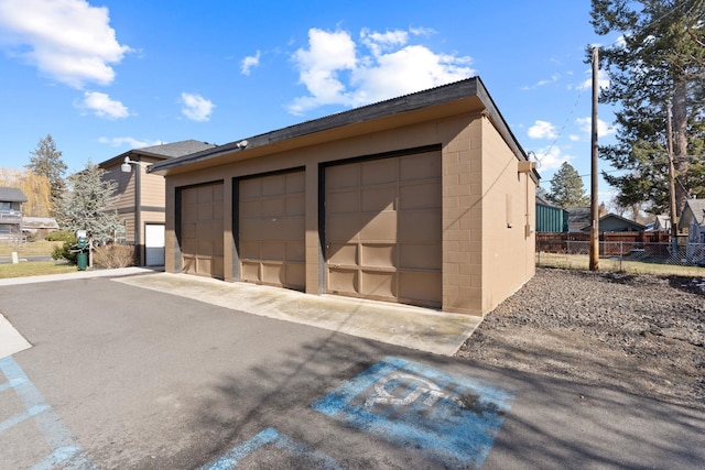 garage featuring fence