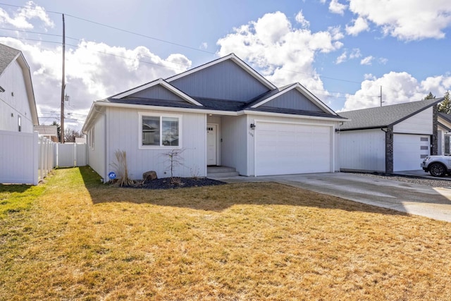 single story home with a garage, fence, driveway, and a front lawn