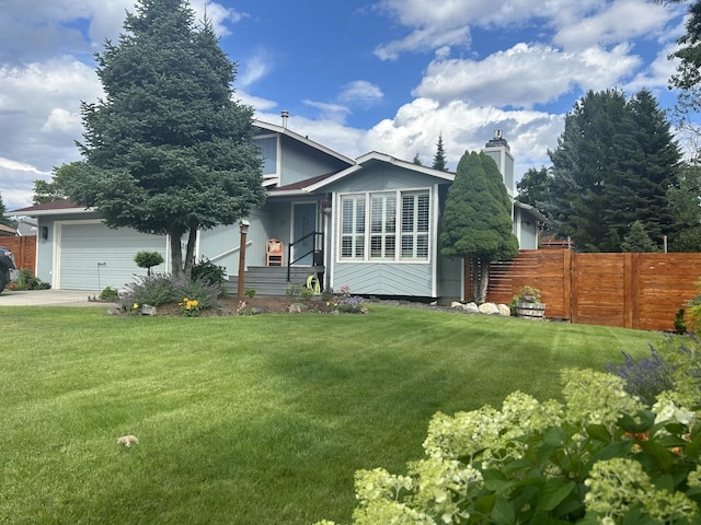 view of front facade featuring an attached garage, driveway, a front yard, and fence