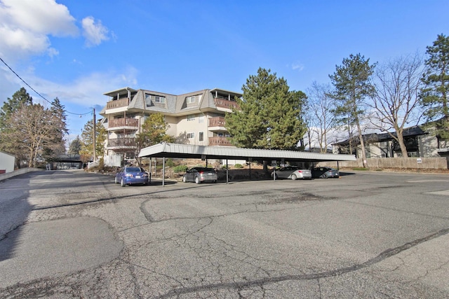 exterior space featuring covered parking