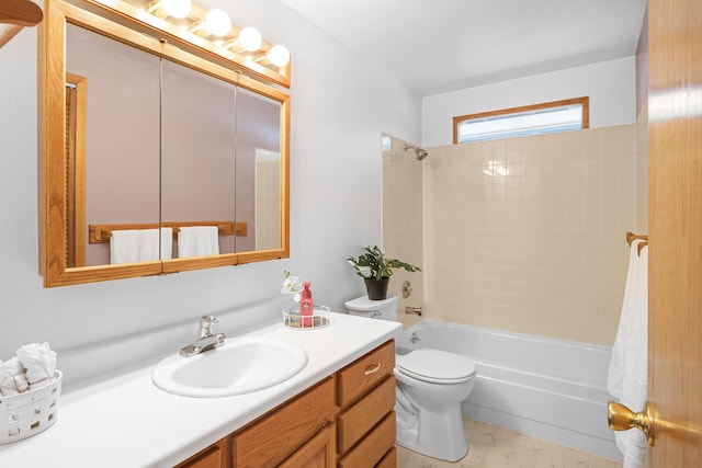 bathroom with shower / washtub combination, vanity, and toilet