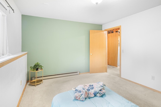 bedroom featuring baseboards, carpet flooring, and baseboard heating