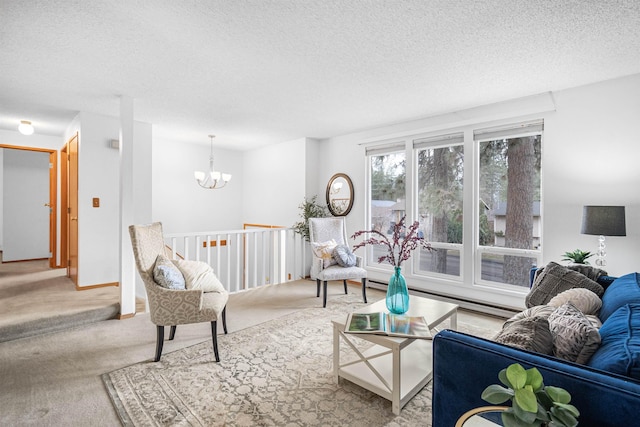 living area with a textured ceiling, a notable chandelier, light carpet, baseboards, and baseboard heating