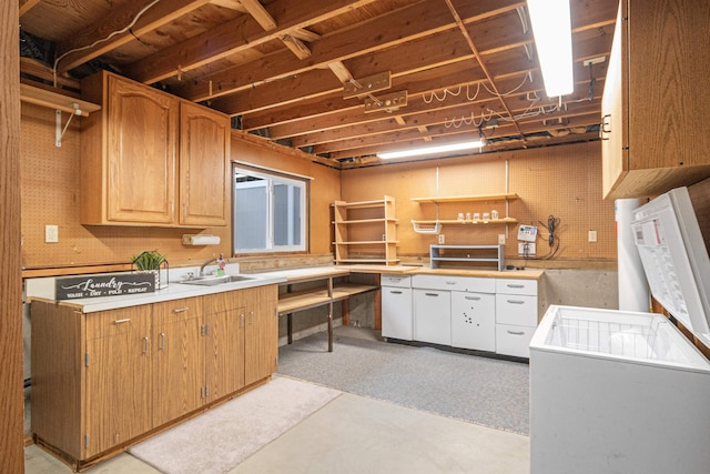 kitchen featuring light countertops and a sink