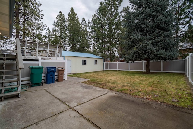 back of house featuring a patio area, a fenced backyard, and a yard