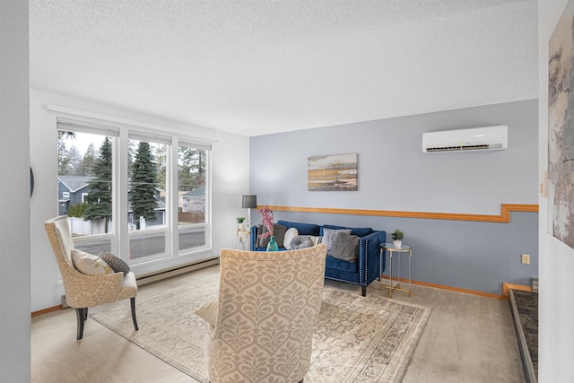 sitting room featuring baseboards, a textured ceiling, a baseboard heating unit, and an AC wall unit