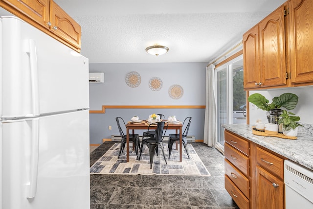 dining space with a textured ceiling