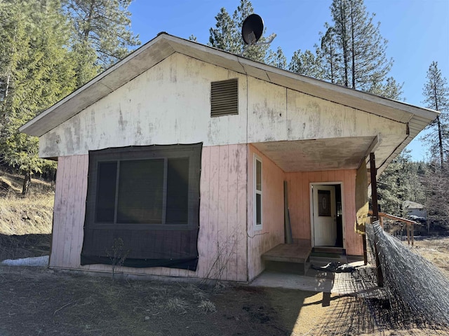 view of property exterior featuring entry steps