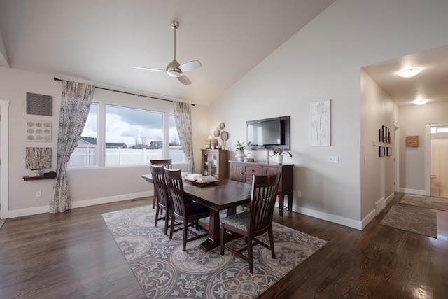 dining area featuring high vaulted ceiling, ceiling fan, baseboards, and wood finished floors