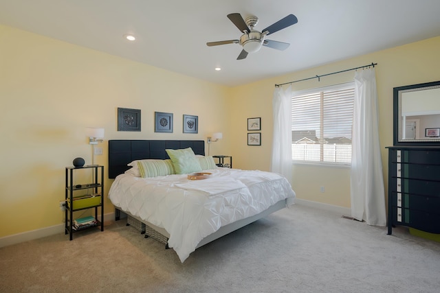 carpeted bedroom featuring recessed lighting, ceiling fan, and baseboards